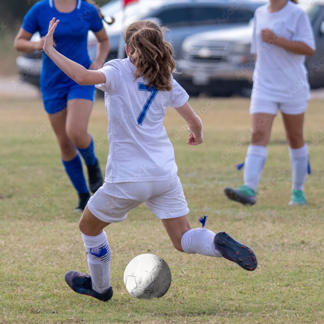 Child playing football