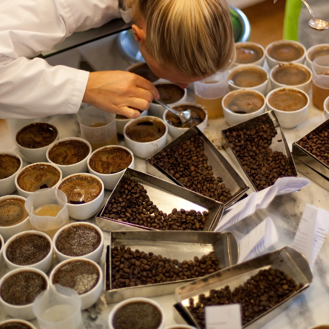 woman tasting coffee