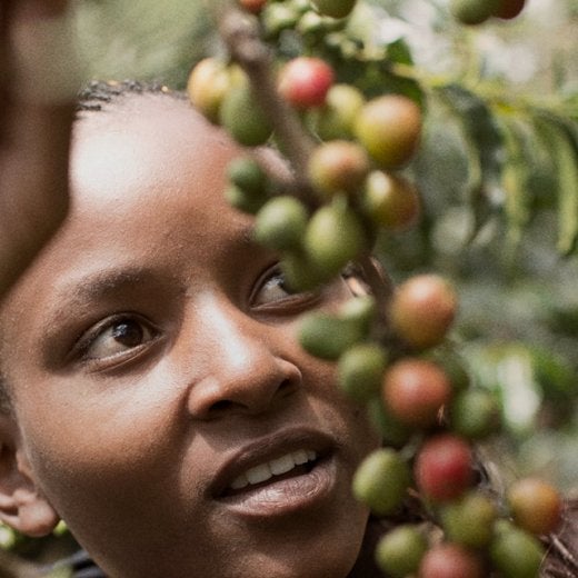 Women with coffee beans .