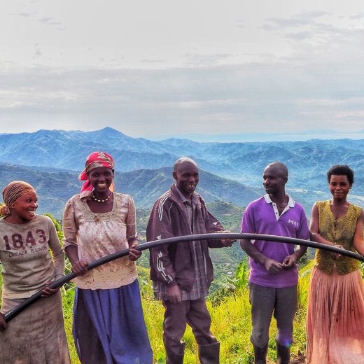 Farmers holding waterpipe